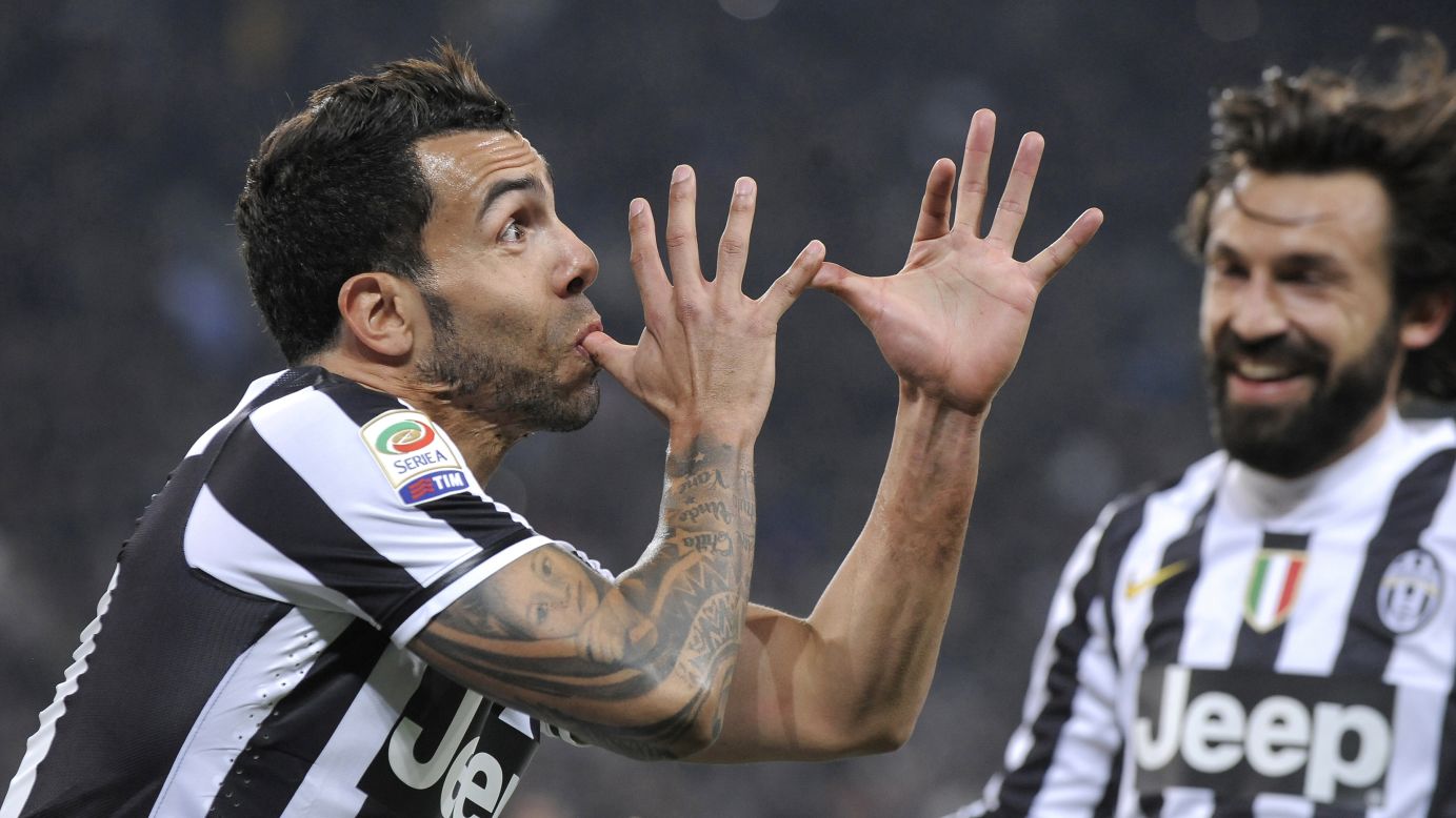 Juventus striker Carlos Tevez, left, celebrates with teammate Andrea Pirlo after scoring against Torino during a Serie A soccer match Sunday, February 23, in Turin, Italy.