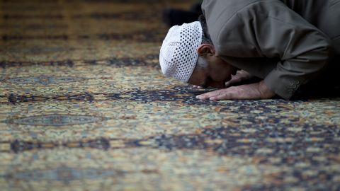 A muslim man prays for murdered aid worker Alan Henning in Manchester Central Mosque in Manchester, England on October 4, 2014. 