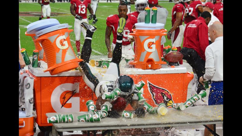 Philadelphia Eagles wide receiver Jeremy Maclin crashes through Gatorade after he was pushed out of bounds Sunday, October 26, in Glendale, Arizona.