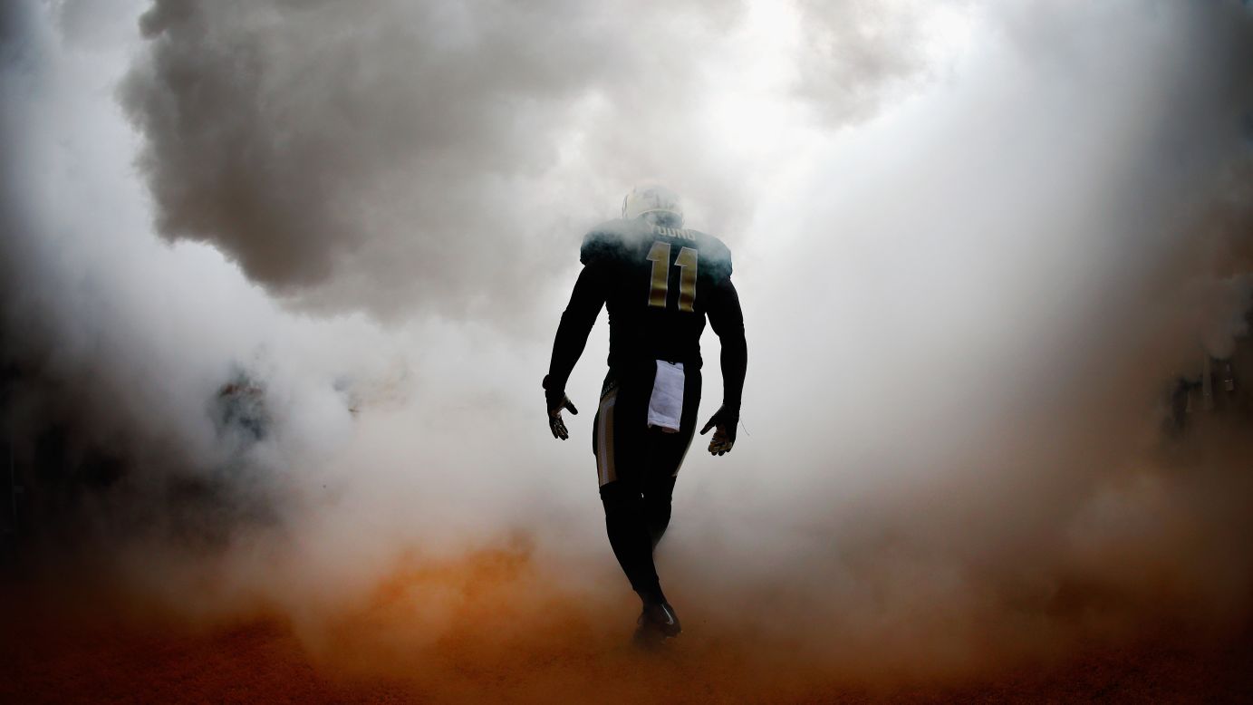 Baylor linebacker Taylor Young walks through artificial smoke before the Bears took on TCU at Baylor's McLane Stadium on Saturday, October 11.