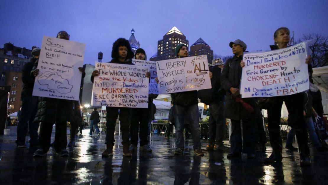 Protesters hold banners in support of Eric Garner at Union Square on December 3, 2014, in New York City. Garner died after being put in a chokehold during an alteration with NYPD officers.