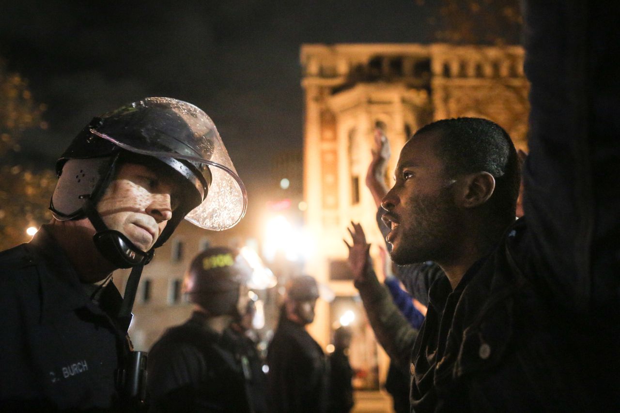 Protesters face off with police in Oakland.