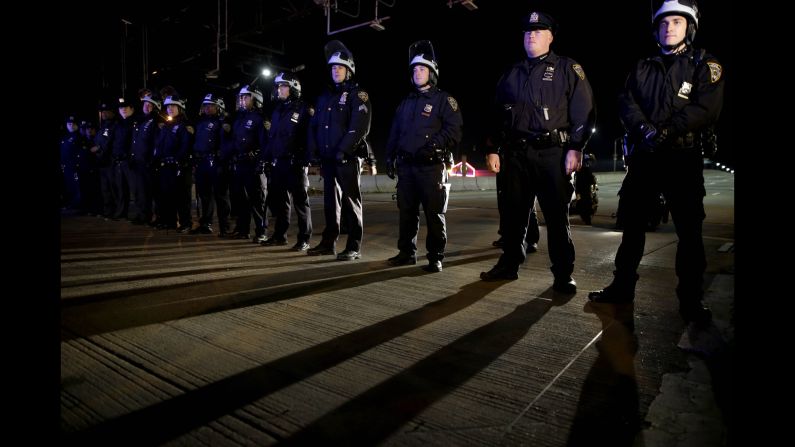Police officers stand guard in New York's Times Square on December 3.