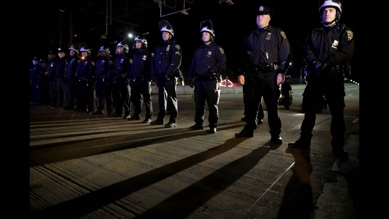 Police officers stand guard in New York's Times Square on December 3.