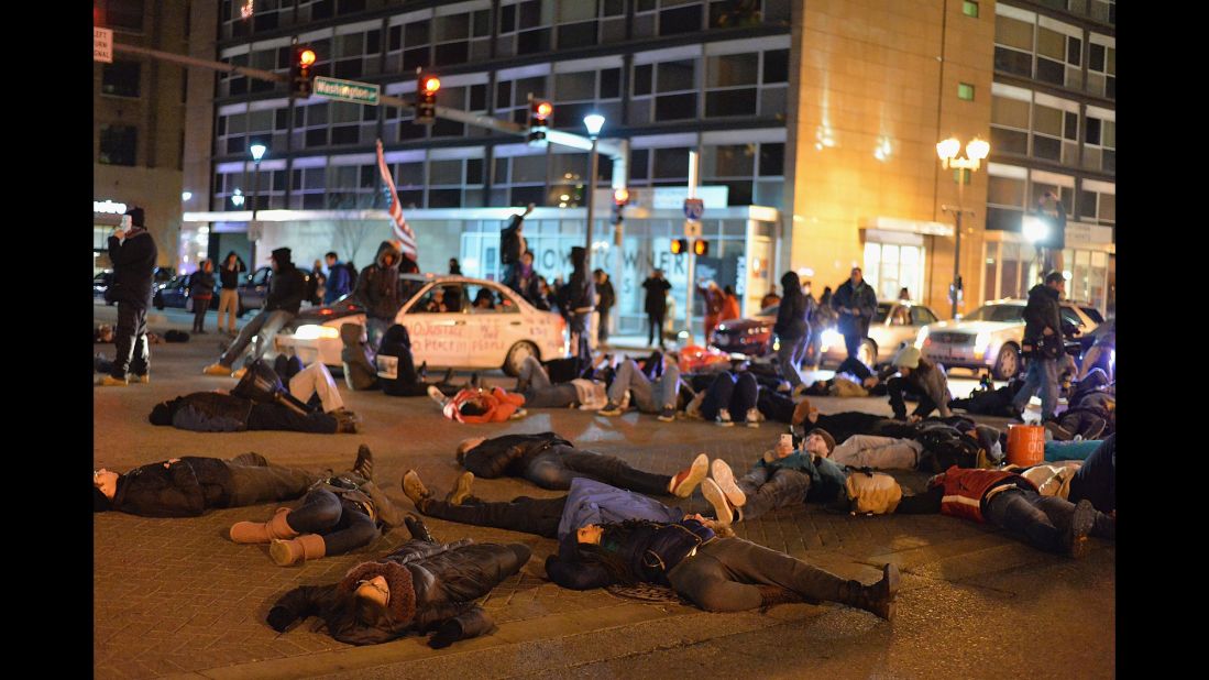 Demonstrators lie in the streets of St. Louis on December 3.