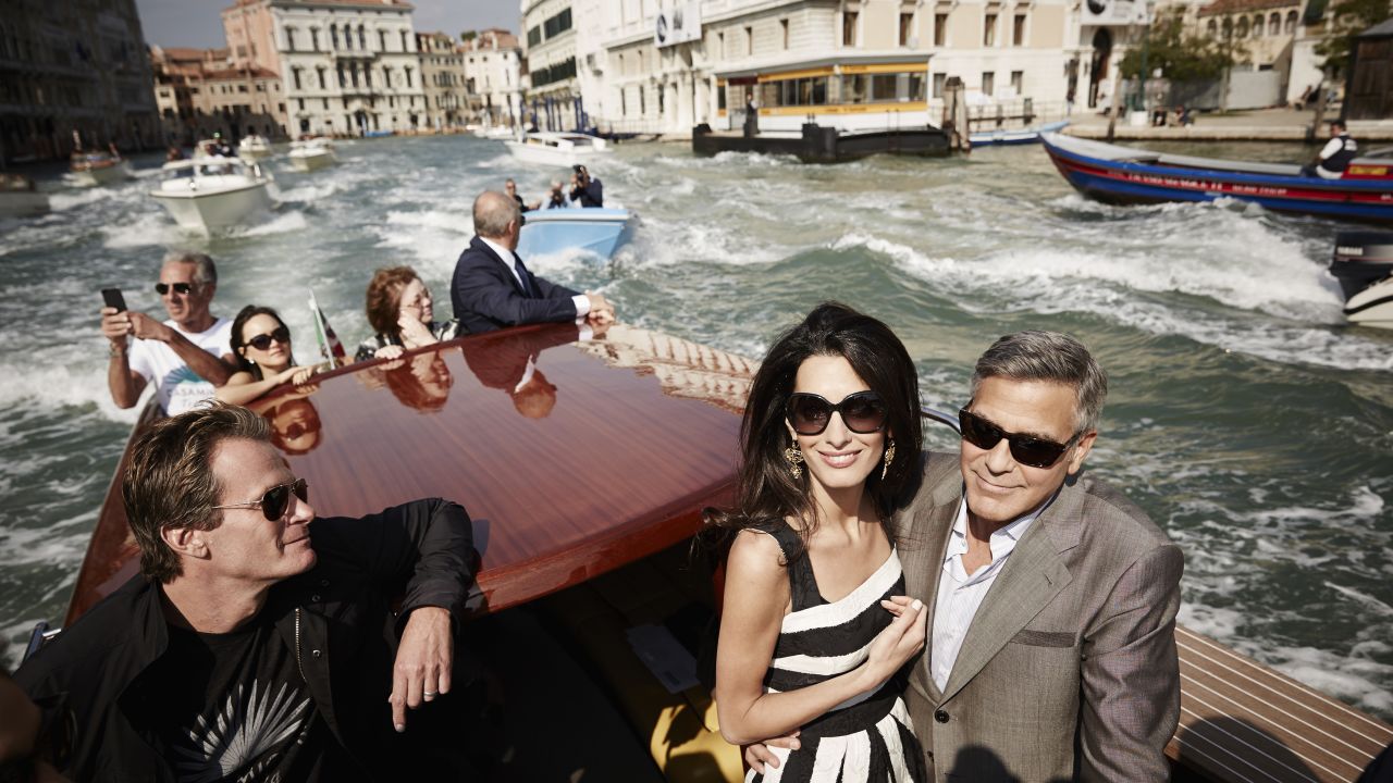 <strong>September 26:</strong> Actor George Clooney, right, and his fiancee, lawyer Amal Alamuddin, arrive in Venice, Italy, on Friday, September 26. The two were married that weekend in a private ceremony <a href="http://www.cnn.com/2014/09/27/showbiz/gallery/clooney-wedding/index.html">attended by some of their celebrity friends.</a> At left is Rande Gerber, husband of model Cindy Crawford.