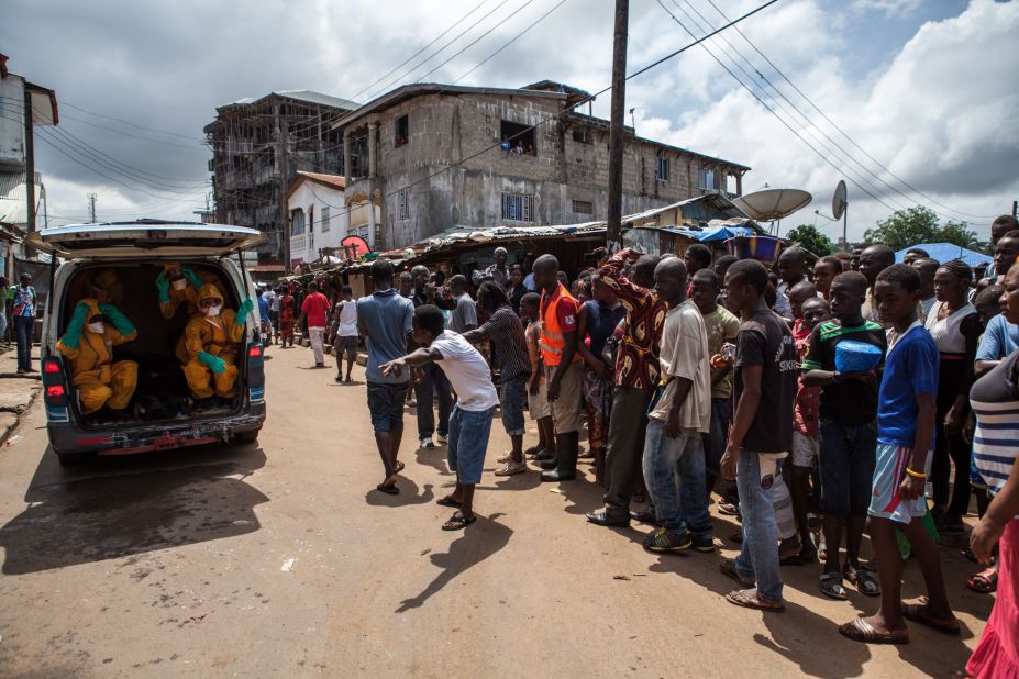 Volunteers arrive to pick up bodies of people who have died of the Ebola virus in Freetown, against a $100 weekly risk-taking compensation. The virus which has so far claimed over 1,400 lives across the country.