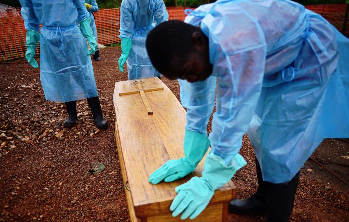 "I think one of the vital things we've failed to adhere to as a people, is not to touch a sick person," said Johansen of a disease in which <a href="index.php?page=&url=http%3A%2F%2Fwww.who.int%2Fmediacentre%2Fnews%2Fnotes%2F2014%2Febola-burial-protocol%2Fen%2F" target="_blank" target="_blank">20% of transmissions happen during burials.</a> Here, government burial team members wearing protective clothing stand next to the coffin of Dr Modupeh Cole -- Sierra Leone's second senior physician to die of Ebola.