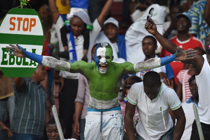 Football is "like a second religion in Sierra Leone." That was before the Ebola outbreak put a stop to organized games, casual kick-abouts, and people gathering to watch the national sport. Here, a fan shows his colors.