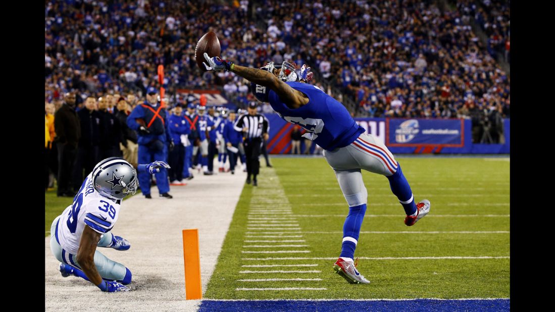 New York Giants wide receiver Odell Beckham Jr. makes a spectacular one-handed touchdown grab while playing Dallas on Sunday, November 23, in East Rutherford, New Jersey.