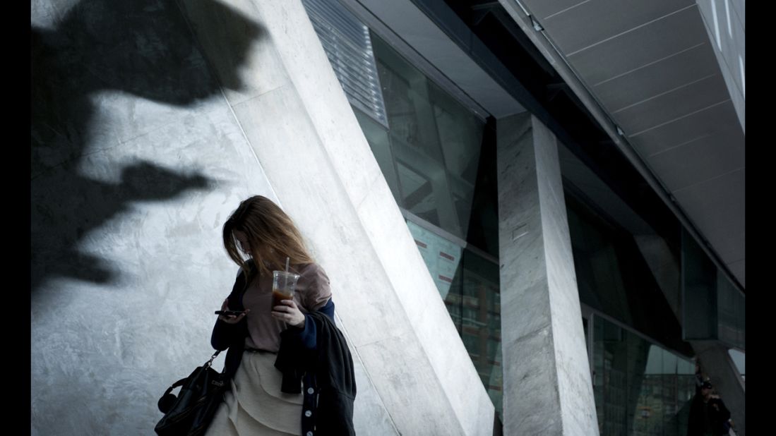 A woman checks her phone in New York. Losekoot has also visited Hong Kong; Seoul, South Korea; Mumbai, India; and London.