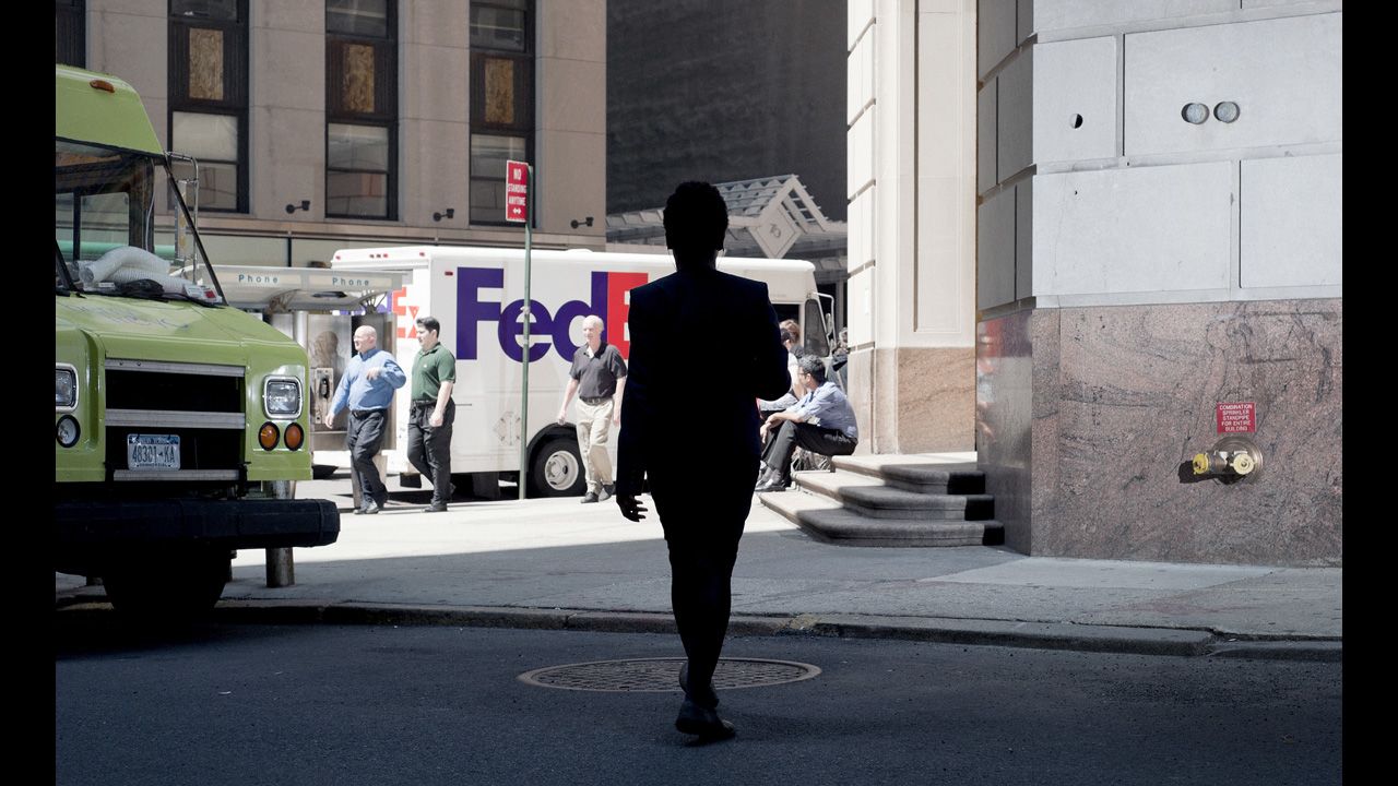 A person appears as a silhouette in New York.
