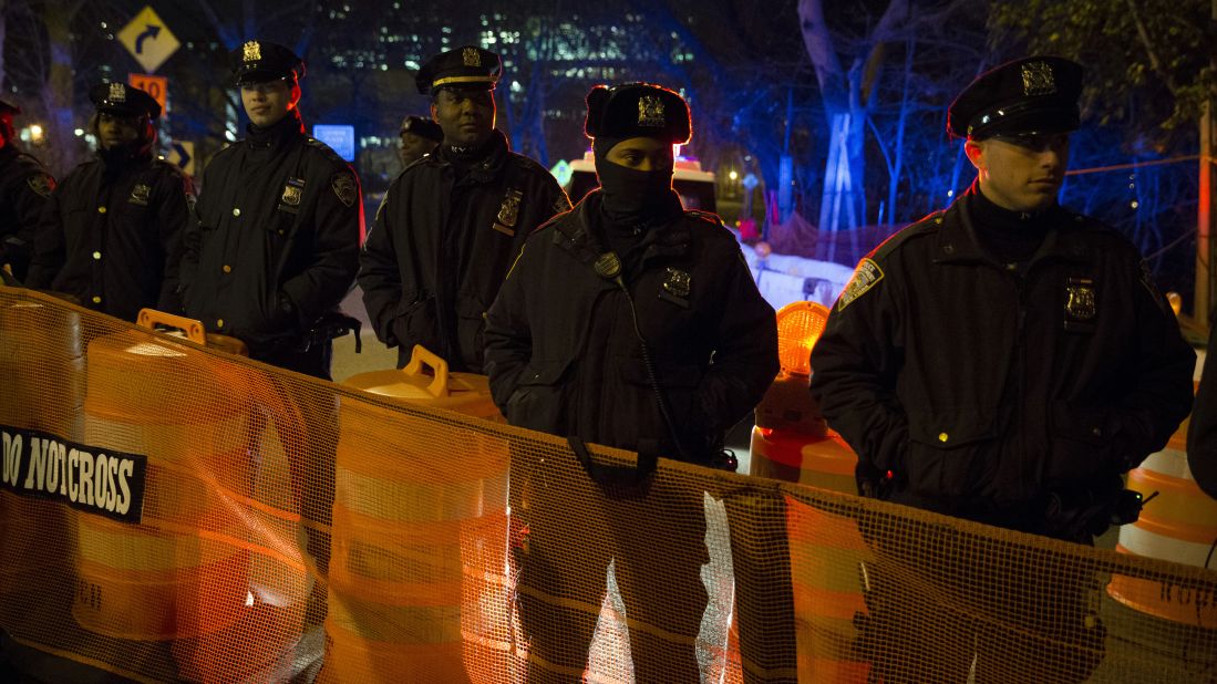 Police officers in New York staff a barricade at a Brooklyn Bridge exit ramp on December 4.
