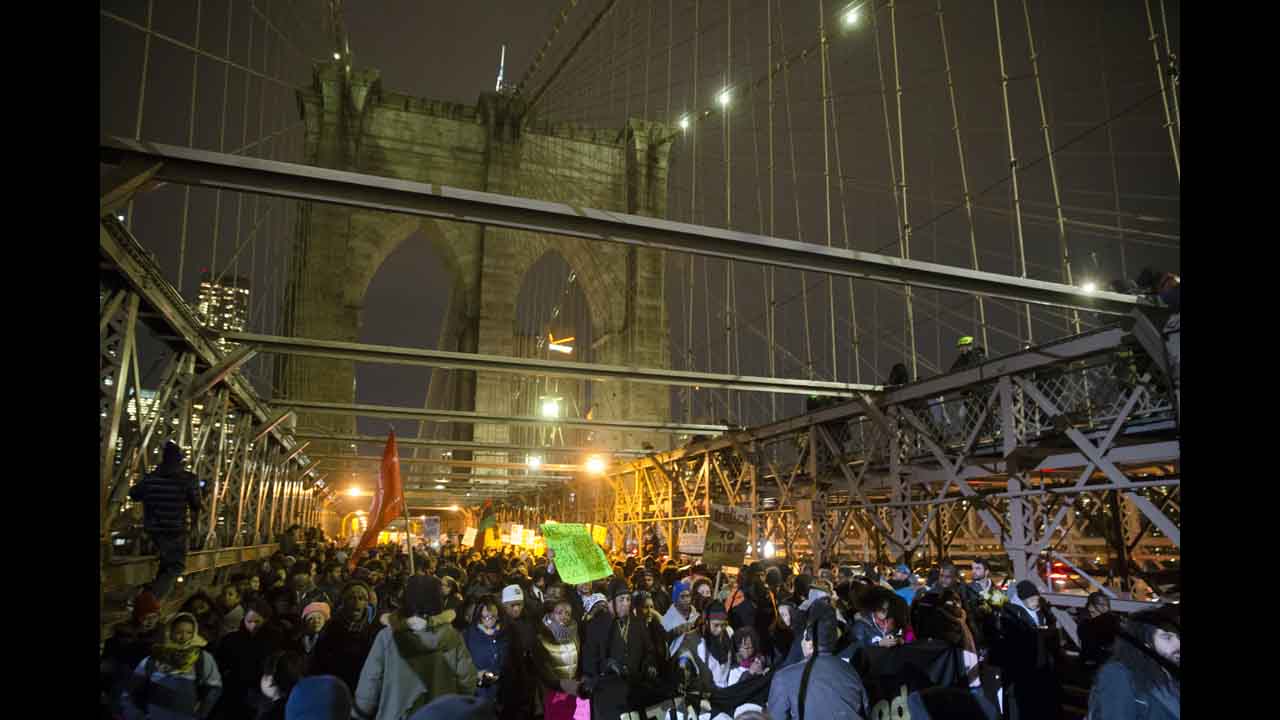 Demonstrators march across the Brooklyn Bridge on December 4. 