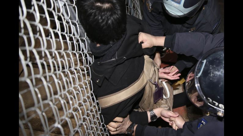 Police detain a protester in New York on December 4.