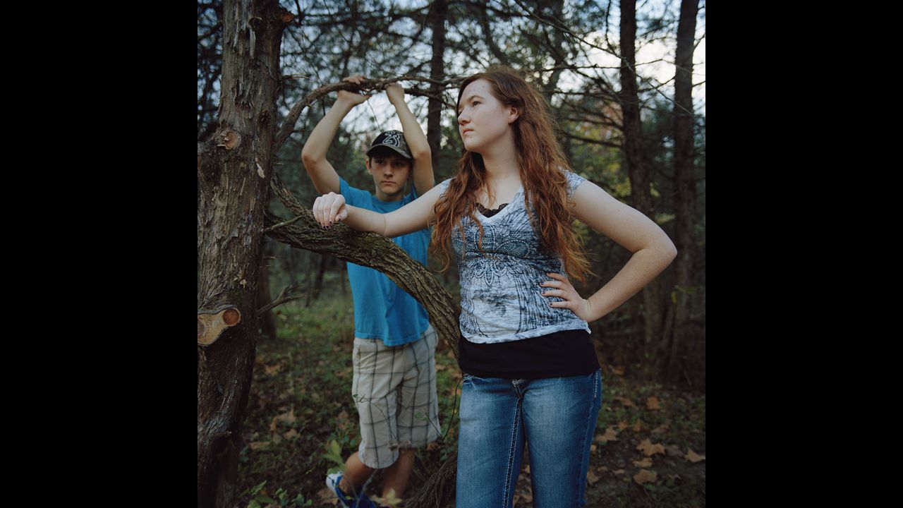 Shalyn Steinbrink and Dylan Daeis in the woods on Hartzog Farm.