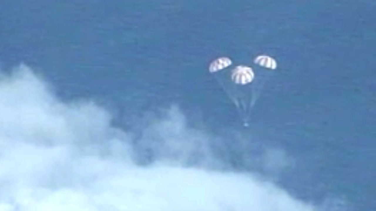 In this frame grab from NASA-TV, the Orion spacecraft descends before splashing down in the Pacific Ocean, Friday, Dec. 5, 2014, following a dramatic test flight that took it to a zenith height of 3,600 miles and ushered in a new era of human exploration aiming for Mars. (AP Photo/NASA)