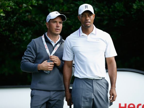 Woods and new swing coach Chris Como are pictured in conversation ahead of the start of the Hero World Challenge in Florida, but the ex-world No.1 has struggled with his game and hit the worst round of his professional career last week. 