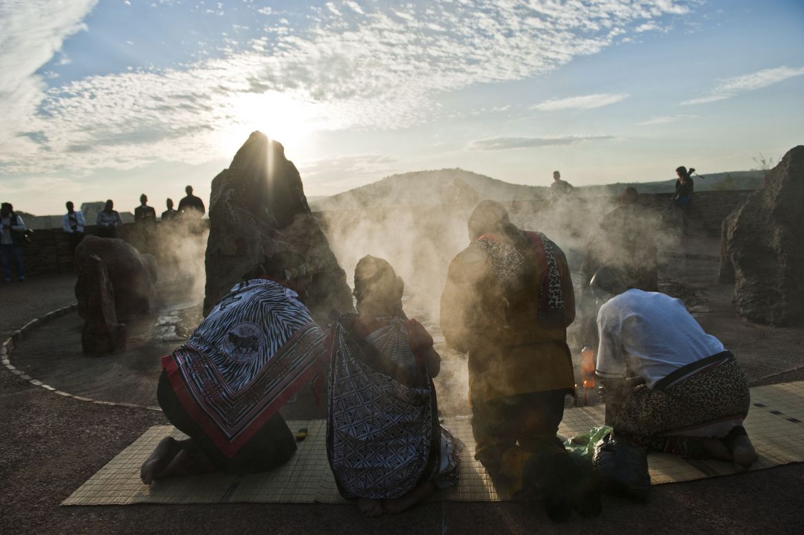 DECEMBER 5 - PRETORIA, SOUTH AFRICA: Traditional worshipers burn herbs in prayer at dawn at Freedom Park for former South African President <a href="http://edition.cnn.com/2014/12/04/world/nelson-mandela-death-anniversary/index.html">Nelson Mandela</a>. Today marks the first anniversary of his death at the age of 95 and events will be held around the country. 
