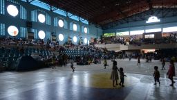 Many in Tacloban have sought shelter in more solid buildings such as school halls as a major typhoon threatens a town so familiar with devastating weather.