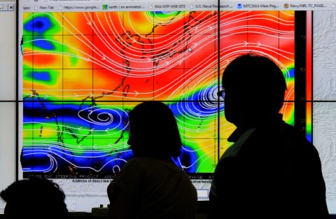Meteorologists from the Philippine Atmospheric, Geophysical and Astronomical Services Administration plot the direction of Hagupit on Thursday, December 4. 