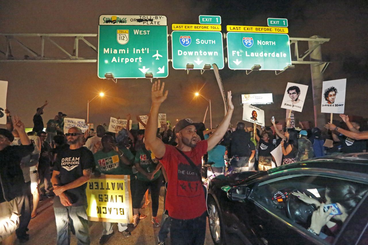 Protesters shut down all eastbound and westbound lanes on Interstate 195, which links Miami Beach to the mainland, on Friday, December 5. 