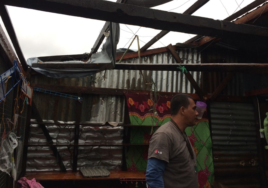 Harry surveys the damage at his home in the Magallanes coastal neighborhood in Tacloban.