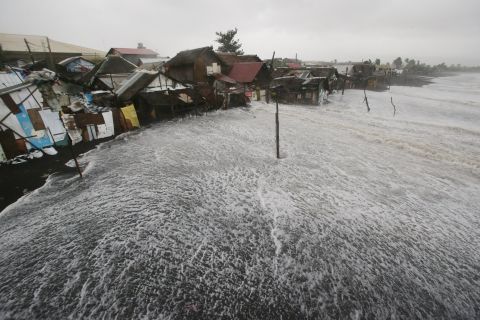 Strong waves crash into coastal houses in Legazpi on December 7.