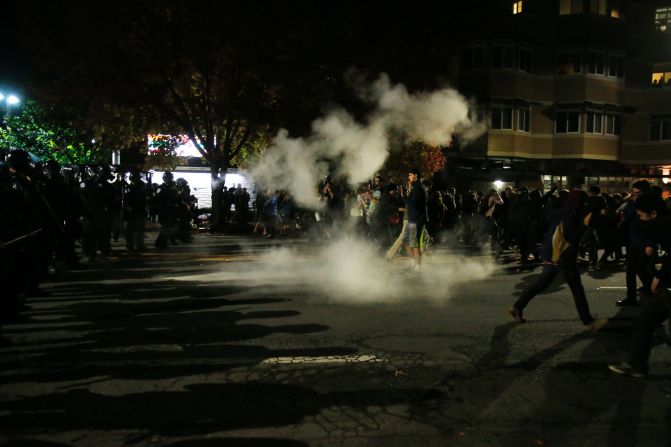Demonstrators retreat in Berkeley, California, after police deploy tear gas during a <a href="index.php?page=&url=http%3A%2F%2Fwww.cnn.com%2F2014%2F12%2F07%2Fjustice%2Fprotests-grand-jury-chokehold%2Findex.html">protest that turned violent</a> before dawn on December 7.
