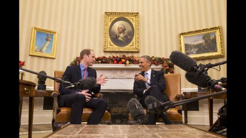 U.S. President Barack Obama laughs with Prince William in the Oval Office of the White House on December 8.