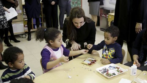 Kate sits next to children December 8 during a preschool class at the Northside Center for Childhood Development in New York.