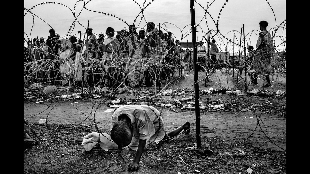 A child passes through barbed wire at a U.N. camp in the capital of Juba.