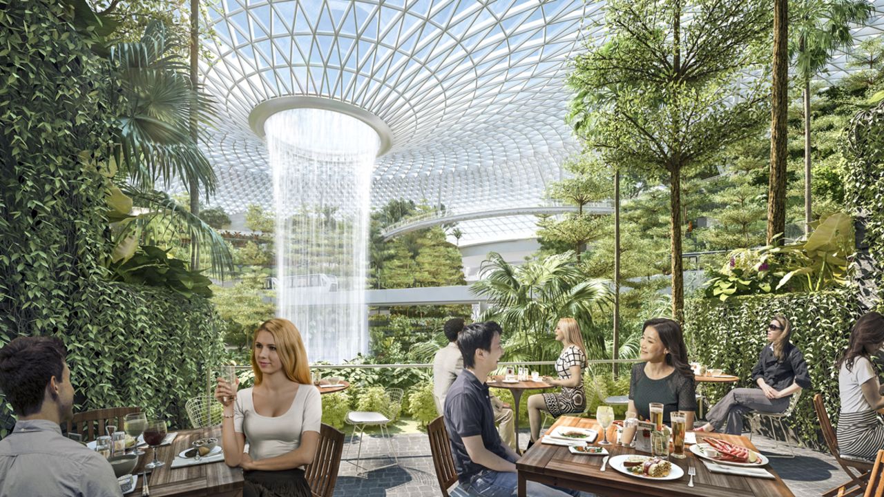 <strong>Indoor rainforest:</strong> Centering around a floor-to-ceiling indoor waterfall and rainforest, there'll be dining and shopping experiences and a new hotel. It will be linked to all terminals for passengers, or even curious tourists, to enjoy.