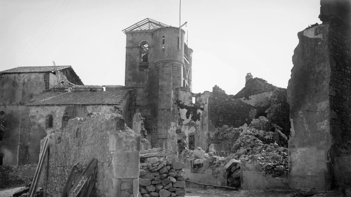 A photo shows the ruins at Oradour-sur-Glane and the church where the village's women and children were killed.