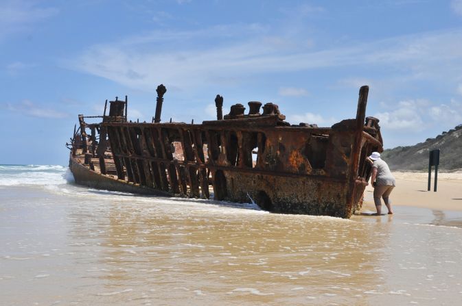 While being towed along the coast, a towline snapped in a cyclone and the <em>Maheno</em> drifted ashore. Most of its remains are now submerged under the sand.