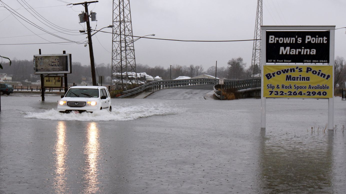 An SUV braves a flooded street in Keyport, New Jersey, on December 9.