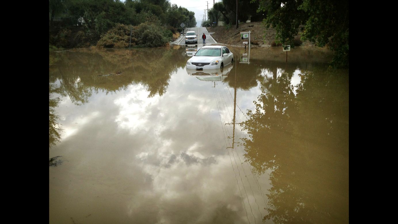 A car sits partially submerged in floodwaters in Hemet, California, on Thursday, December 4, after overnight rains doused the area.
