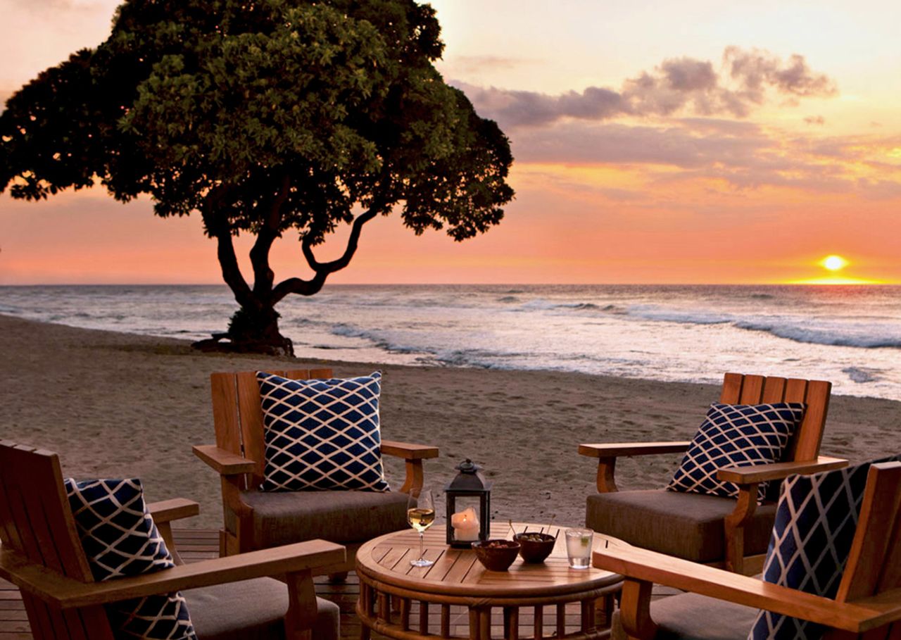 At Beach Tree Bar on Hawaii's Big Island, sunset cocktails sometimes mix with turtle watching. Best viewed with a signature limoncello-pear cocktail in hand.