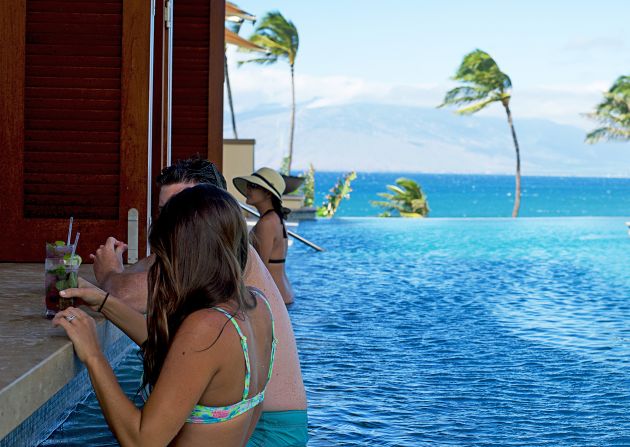 At the Four Seasons Maui's Serenity Pool Bar, mai tais are served inside of pineapples on request. Purple things with mint leaves are good, too.