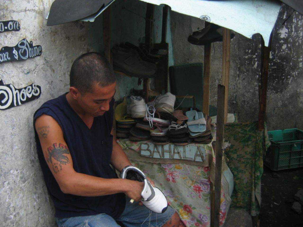 An inmate opens up his own business repairing shoes inside the prison. Narag says most inmates use their skills to earn extra money which they usually send back to help support their families.