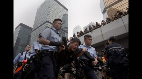 A protester is carried away by police officers on December 11.