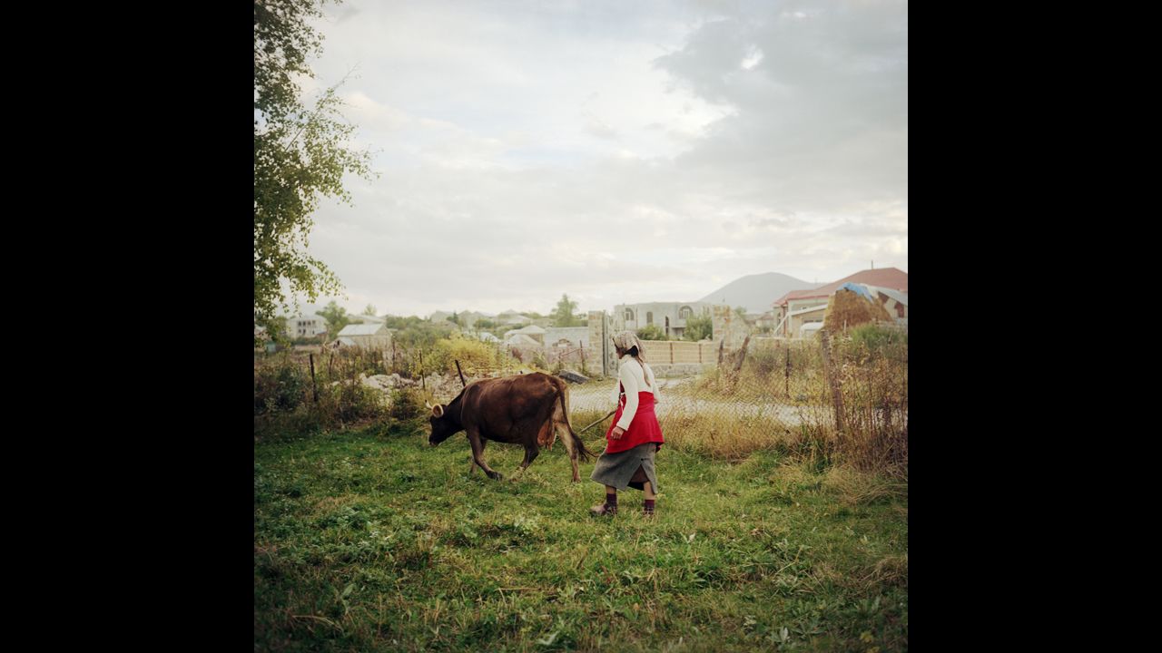 A woman named Cirush fetches her cow in the evening. Her husband and one of her sons work in Russia. Her other son is in the military.