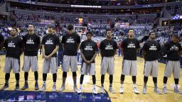 Members of the Georgetown basketball team stand for the National Anthem wearing "I Can't Breathe" t-shirts before an NCAA college basketball game against Kansas,  on Wednesday, December 10 in Washington.