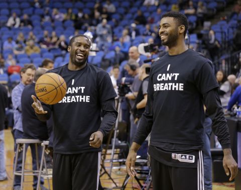 Portland Trail Blazers Wesley Matthews, left, and Dorell Wright wear the shirts while warming up for a game in Minneapolis on December 10.