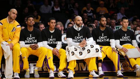 Los Angeles Lakers' Nick Young, Jordan Clarkson, Carlos Boozer, Wayne Ellington and Jeremy Lin   protest during a game against the Sacramento Kings on December 9 in Los Angeles.