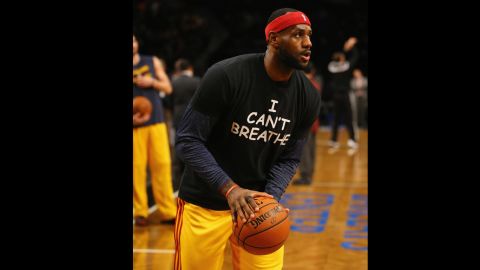 LeBron James of the Cleveland Cavaliers takes a stand as he warms up for a game against the Brooklyn Nets on December 8 in New York.