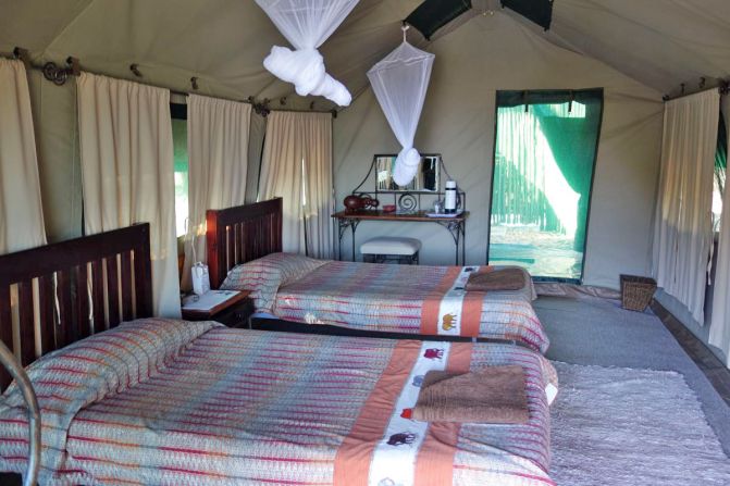Goliath Safaris' tents with teak finishes and open-air showers ensure guests are close to wildlife that includes hippo, elephant, lion, leopard and wild dogs.