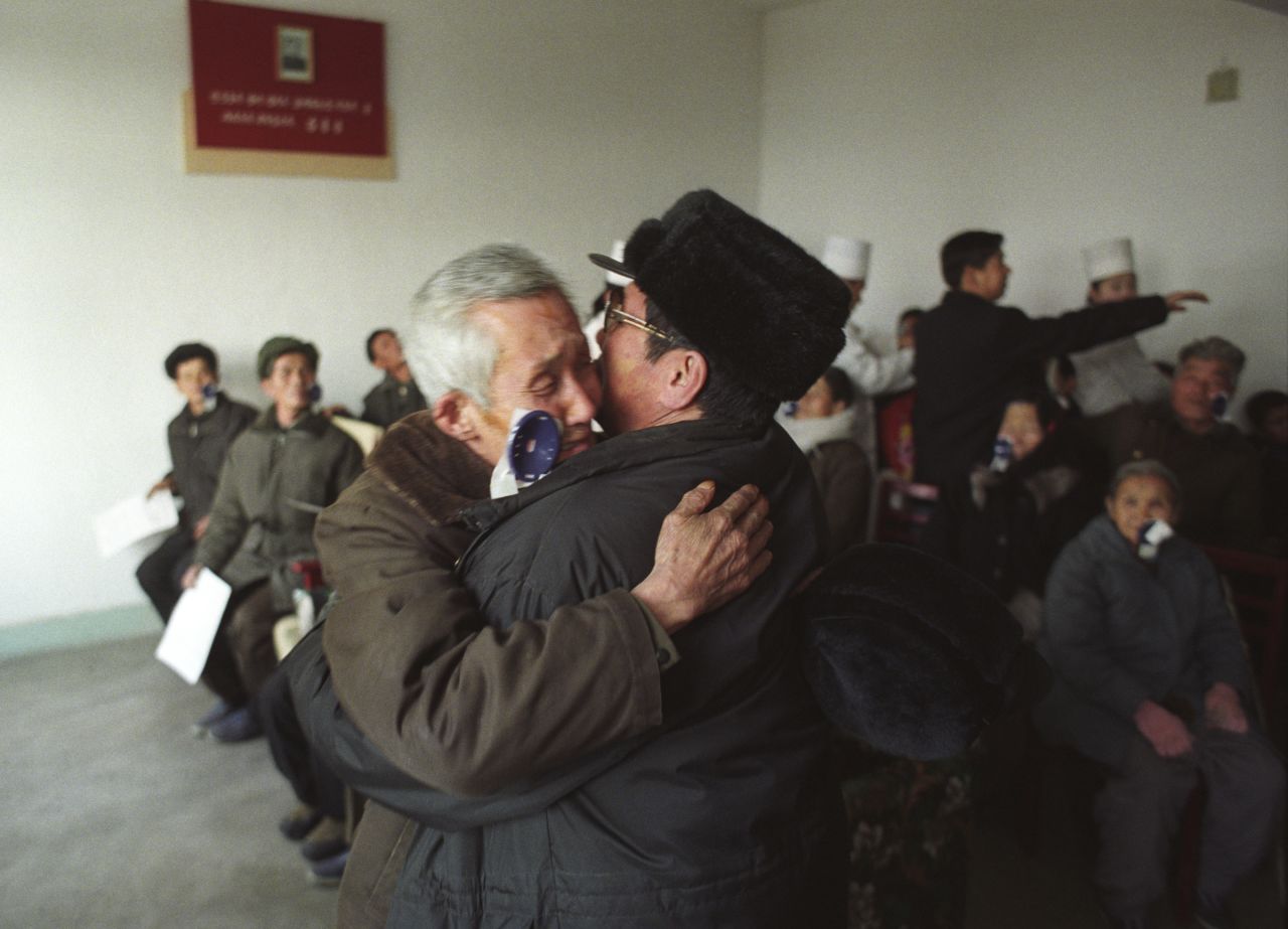Han Mong Guk, 80, embraces his son as he sees him for the first time in 10 years after eye surgery in North Korea in 2005. 