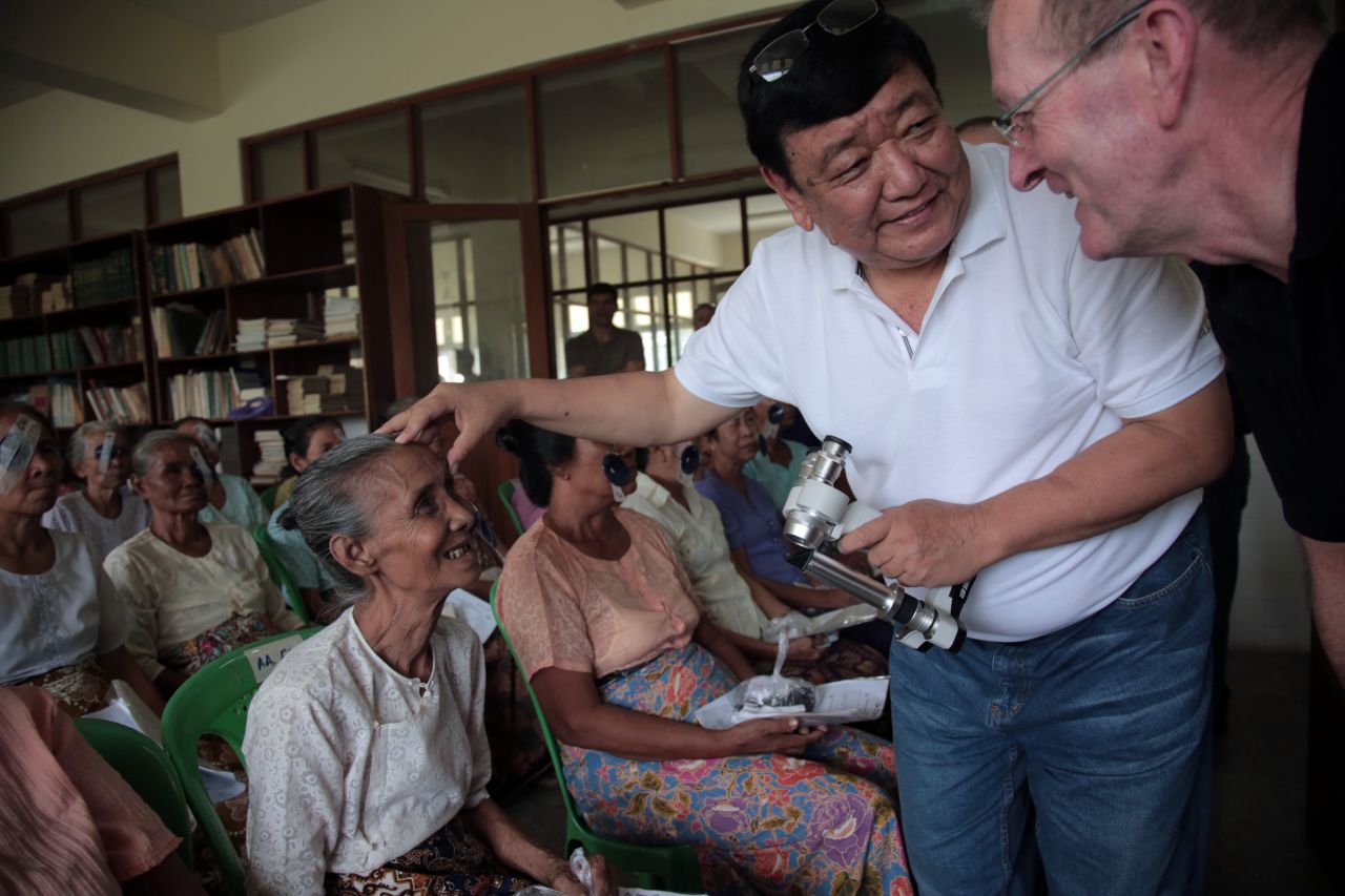 Dr. Sanduk Ruit examines Daw Yin, 65, after surgery in the Myanmar Outreach Eye Clinic in Yangon in 2013. 