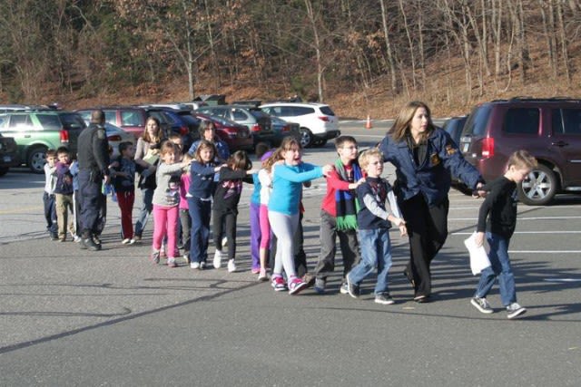Police evacuate children from Sandy Hook Elementary School in Newton in 2012.